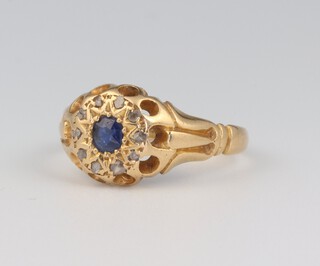 An Edwardian 18ct yellow gold sapphire and diamond ring, the centre stone 0.15ct, the 10 diamond chips approx. 0.10ct. size M, 3.4 grams 