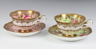 Two Royal Albert tea cups and saucers with gilt banding, floral and rose decoration (seconds) 