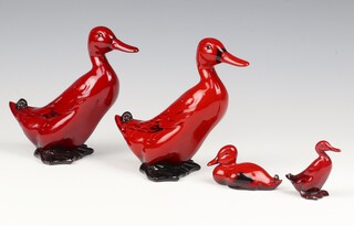 A Royal Doulton flambe figure of a standing duck 187 15cm, a ditto 15cm, a small ditto by Noke 3cm and a sitting duck 2cm 