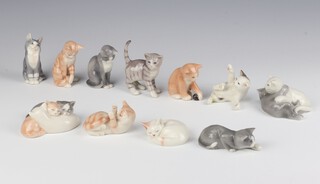 Twelve Royal Copenhagen Classical Cat Collection - 684, 687, 685, 677, 680, 683, 679, 688, 686, 678, 681 and 682 (a/f), all figures are 8cm  together with an open wall unit 