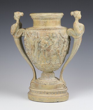 A 19th Century French composition figure of a 2 handled classical vase decorated with classical figures at pursuits with caryatid handles 30cm 