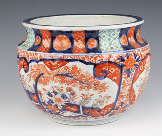 A late 19th Century Imari fluted jardiniere decorated with panels of flowers and birds 28cm 