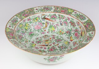 A late 19th Century Chinese famille rose deep bowl decorated with exotic birds amongst flowers 40cm 