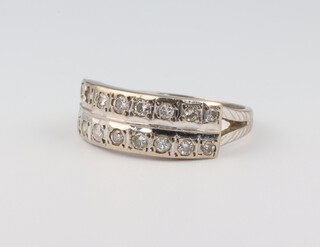 A white gold, testing as 18ct, 16 stone double row diamond ring, size L 1/2, approx. 1.6ct 