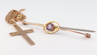 A 9ct yellow gold cross pendant together with a ditto chain 44cm, 3.5 grams and a 9ct yellow gold amethyst bar brooch 