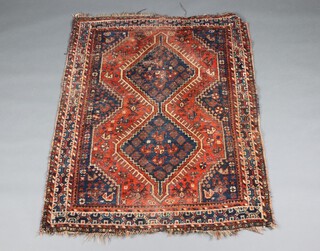 A brown and blue ground Afghan rug with 3 medallions to the centre 150cm x 116cm 