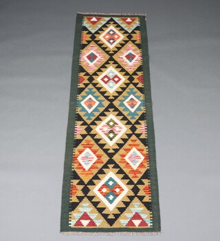 A black and brown ground Meshwani runner with overall diamond design 196cm x 62cm 