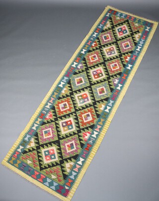 A turquoise and black ground Maimana Kilim runner with all over geometric design 294cm x 88cm 