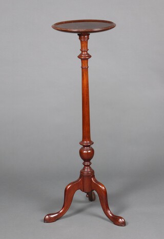 An Edwardian Georgian style circular mahogany torchere, raised on a turned column and tripod base 95cm h x 31cm diam. 