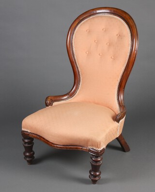 A Victorian mahogany show frame nursing chair upholstered in pink buttoned material, raised on turned supports 91cm h x 55cm w x 47cm d (seat 30cm x 33cm) 