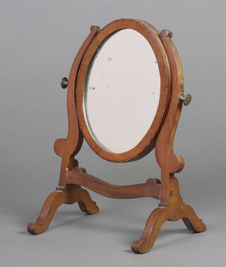 A 19th Century oval plate dressing table mirror contained in an inlaid mahogany swing frame 41cm h x 