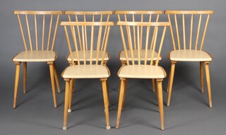 A mid-Century set of 6 Ercol style beech and plywood stick and rail back dining chairs, raised on turned supports 81cm h x 40cm w x 40cm d (seat 32cm x 32cm) 