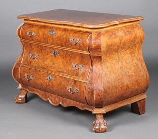 A 20th Century figured walnut bombe commode of serpentine outline, raised on cabriole supports, marked to the back PEB Holland, 76cm h x 97cm w x 50cm d  