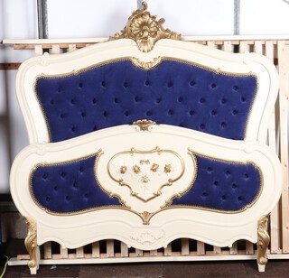 A French style bedstead, white and gilt painted with shell carving to the back 163cm h x 160cm w x 198cm long, complete with slatted base, 2 slats are damaged  