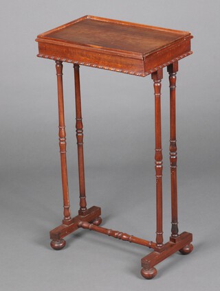 A 19th Century rectangular mahogany occasional table, raised on turned supports with H framed stretcher with replacement bun feet 72cm h x 39cm w x 25cm d 