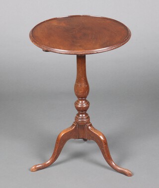 A 19th Century circular mahogany snap top wine table, raised on a pillar and tripod base 66cm h x 44cm diam. 