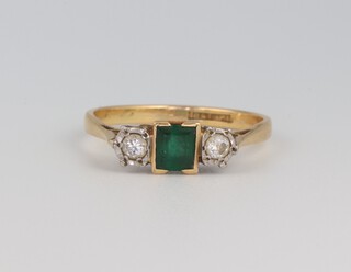 An 18ct yellow gold emerald and diamond ring 2.4 grams, the emerald approx. 0.25ct, the diamonds 0.06ct (2), size M, 2.4 grams 