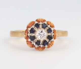 An 18ct yellow gold sapphire and diamond cluster ring, approx. 0.01ct, the sapphires 0.05ct, size M, 4.9 grams 