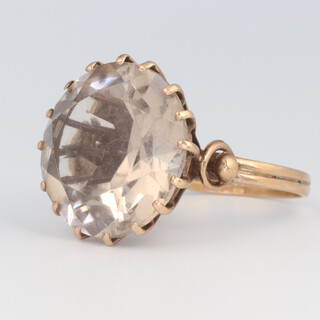 A 9ct yellow gold circular cut quartz ring, size L 1/2, 8.3 grams