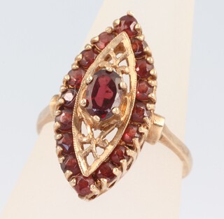 A 9ct yellow gold marquise shaped garnet 0.7ct ring 4.5 grams, size N 1/2