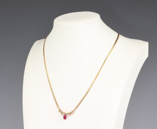 A 9ct yellow gold ruby and diamond pendant on chain, the oval ruby approx. 0.5ct, the 2 diamonds 0.02ct each, the chain 40cm 