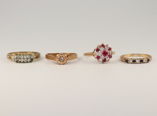 Three 9ct yellow gold gem set rings, sizes N, O and P, 6.7 grams and a gilt ditto 