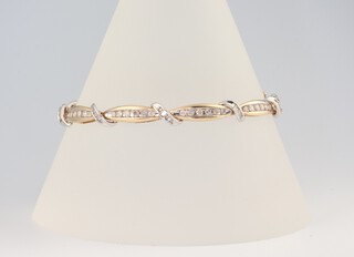 A 9ct yellow and white gold diamond set bracelet, 8.9 grams, 18cm 