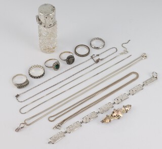 A silver mounted scent and items of silver jewellery including a bracelet, necklaces, rings, etc 40 grams