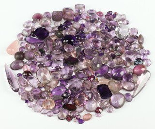 A quantity of loose polished amethyst and other stones 