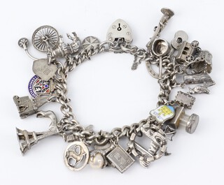 A silver charm bracelet 78 grams