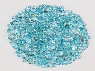 A quantity of polished loose topaz and other stones