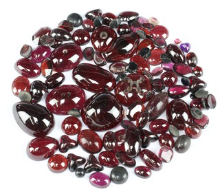 A quantity of loose polished garnet and other stones 