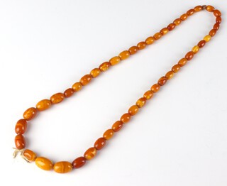 A string of amber, butterscotch coloured graduated beads, the smallest 5mm, the largest 20mm, 52cm, 21.4 grams 