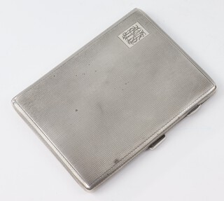 An Art Deco silver engine turned cigarette case with engraved monogram Birmingham 1927, 176 grams gross