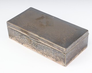 A silver rectangular engine turned cigarette box with monogram, rubbed marks, 18cm 