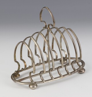 An Edwardian silver 6 bar dome topped toast rack on bun feet, Chester 1903, 14cm, 162 grams 