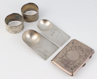 Two silver Art Deco style tea and coffee caddy spoons London 1960, together with an Edwardian silver card case, and 2 napkin rings gross weight 160 grams 