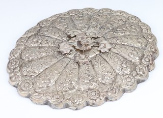 A Persian repousse white metal oval mirror with bird handle, 21cm 