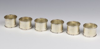 A set of 6 silver napkin rings, 114m grams, Birmingham 1928, engraved monograms 