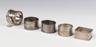 A silver napkin ring Birmingham 1965, 3 others, 114 grams, a plated ditto with Kangaroo mount 