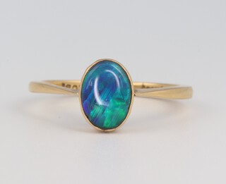 A 9ct yellow gold oval opal 1.5ct ring size S, 3.2 grams 