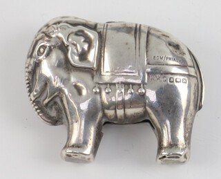 A silver rattle in the form of a standing elephant 5cm Birmingham 1937, 10 grams gross 