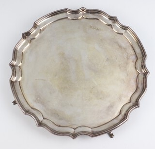 A silver salver with Chippendale rim and hoof feet, Sheffield 1977 maker Poston Products Ltd 784 grams, 30cm 