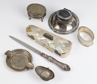 An Edwardian silver capstan inkwell Birmingham 1907 8.5cm, an oval silver trinket box Birmingham 1918, a napkin ring, fluted salt, a Sterling ashtray, silver handled paper knife and mother of pearl trinket box (a/f)