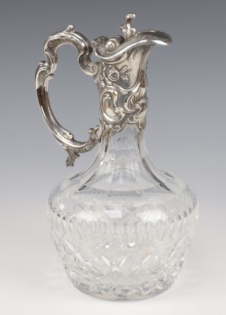 A silver plated mounted cut glass ewer with C scroll handle 26cm 