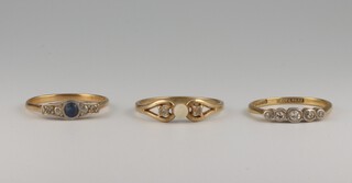 Two 18ct yellow gold gem set rings, sizes N and P, 4.2 grams, a 9ct ditto size R, 1.6 grams 