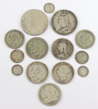 A small quantity of pre-1947 English coinage including an 1889 crown, a 1935 ditto, 5 half crowns, 2 florins, 2 sixpences and 2 thrupenny bits, 156 grams 