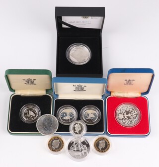 A 1977 silver commemorative coin, a five pound proof coin, a 2014 Tuvalu one dollar, a 2013 five dollar, 2 two pound coins, 1 one pound coin, 2 ten pence pieces and 1 ten piece, 182 grams 