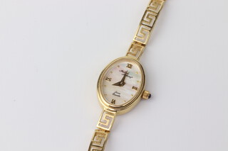 A lady's 14ct yellow gold Michael Anthony quartz wristwatch on a ditto strap, gross weight including movement and glass, 12 grams 