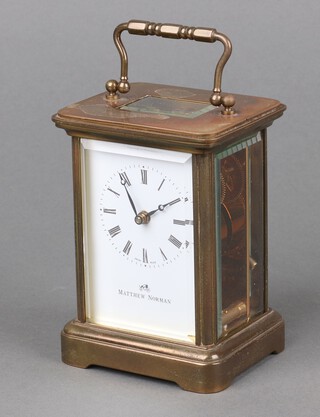 Mathew Norman, a 20th Century carriage clock with enamelled dial and Roman numerals marked Mathew Norman, the back plate numbered 1754 11cm x 8cm x 7cm, complete with key 